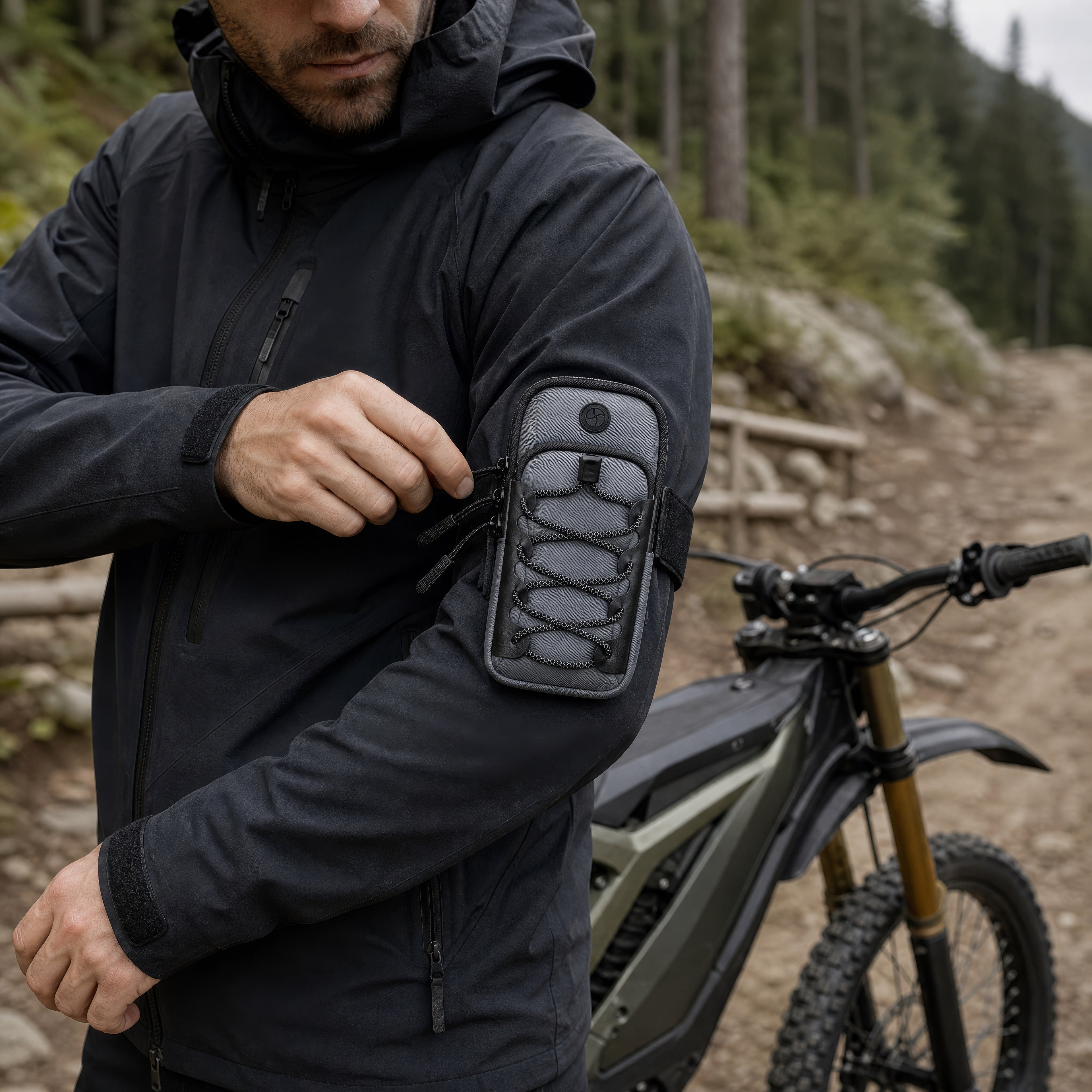Trail rider wearing the Smoke Gray arm phone pouch